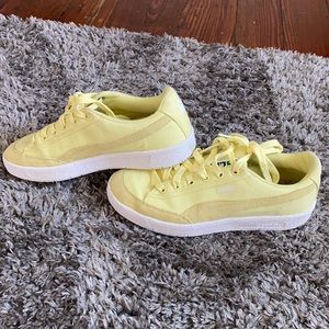 Bright yellow puma sneakers
